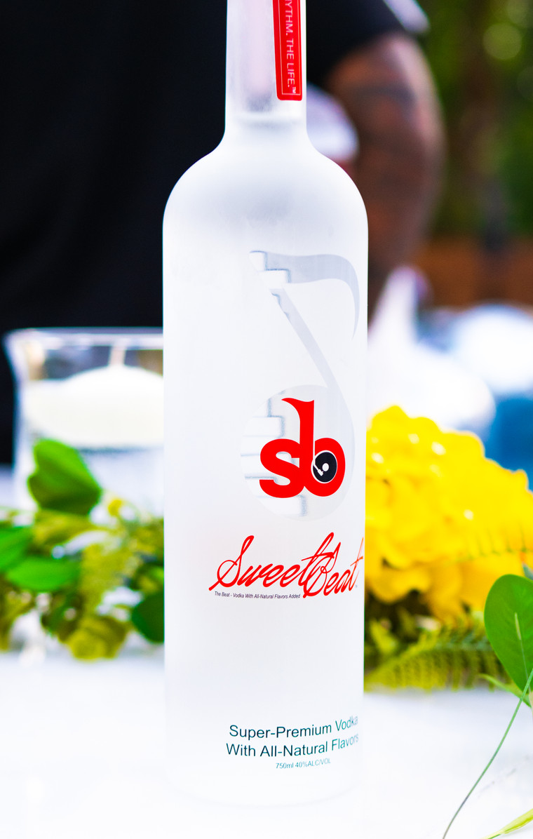 SweetBeat Vodka bottle styled with yellow flowers